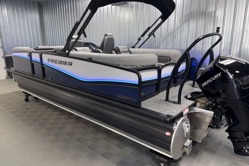 Slide: The Image of 2026 Premier 230 Solaris RF Tritoon with Mercury engine in showroom. - 38