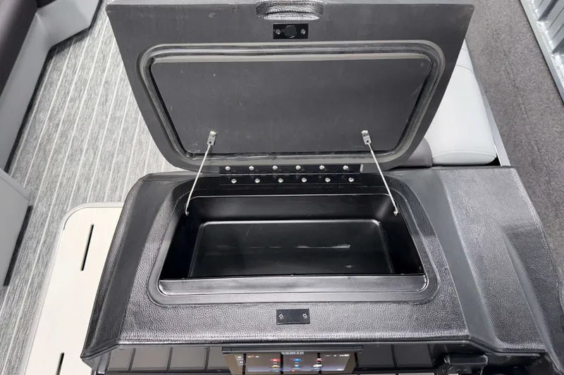 Slide: The Image of Open storage compartment on 2026 Premier 230 Solaris RF Tritoon boat. - 15