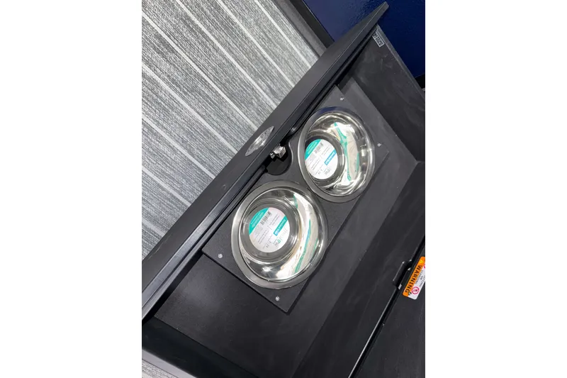 Slide: The Image of Interior detail of 2026 Premier 230 Solaris RF Tritoon with built-in cup holders. - 19