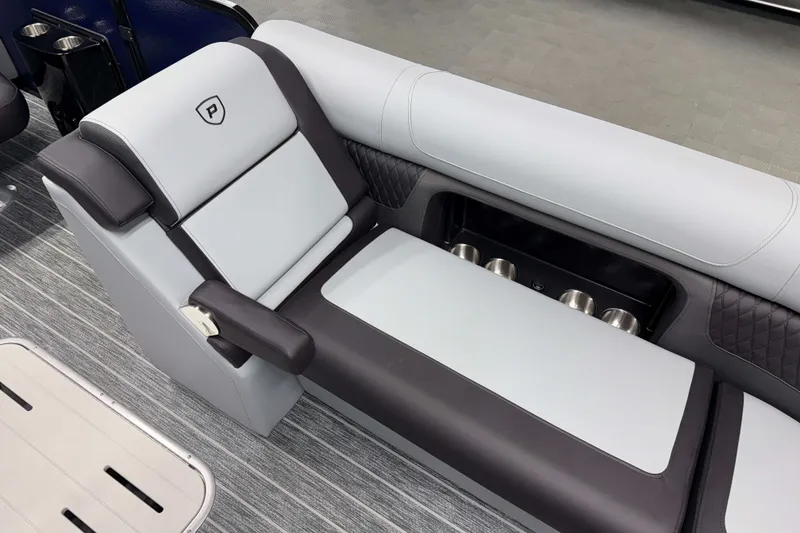 Slide: The Image of 2026 Premier 230 Solaris RF Tritoon luxury seating with integrated cup holders and sleek design. - 23