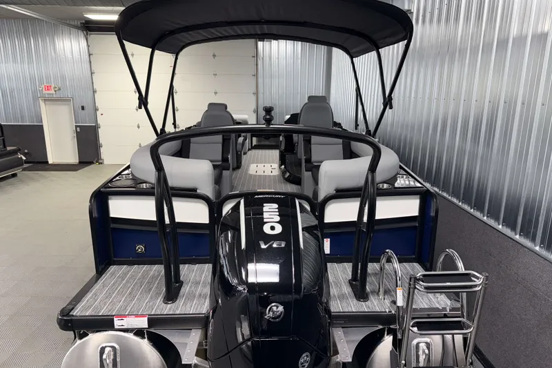 Slide: The Image of 2026 Premier 230 Solaris RF Tritoon with V8 engine in a showroom setting. - 34