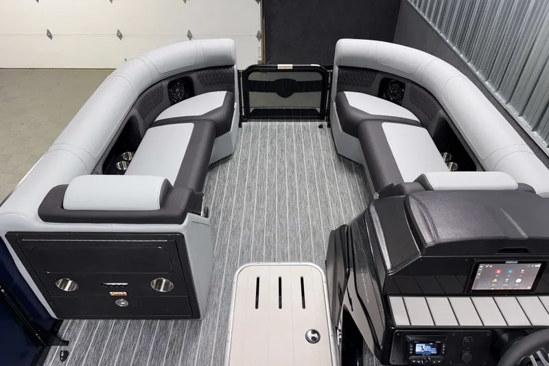Slide: The Image of Interior of 2026 Premier 230 Solaris RF Tritoon with modern seating and control panel. - 21