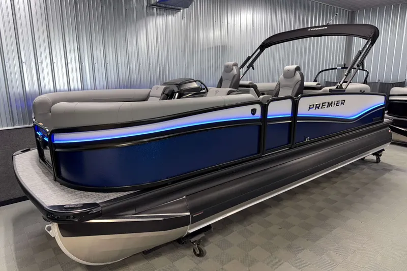 Slide: The Image of 2026 Premier 230 Solaris RF Tritoon boat with sleek design and blue LED lighting. - 37
