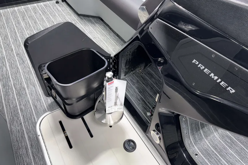 Slide: The Image of Interior of 2026 Premier 230 Solaris RF Tritoon with storage compartment and sleek design. - 16
