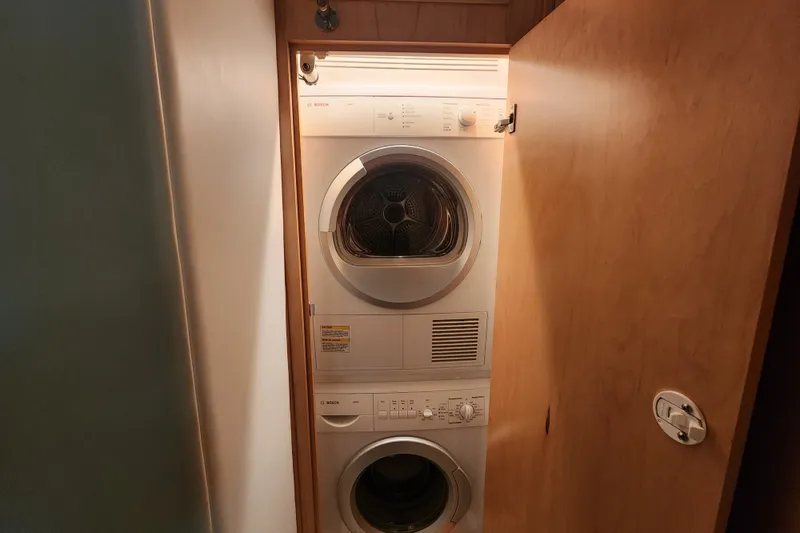 Slide: The Image of Stacked washer and dryer in 1999 Hatteras 65 Convertible yacht. - 32