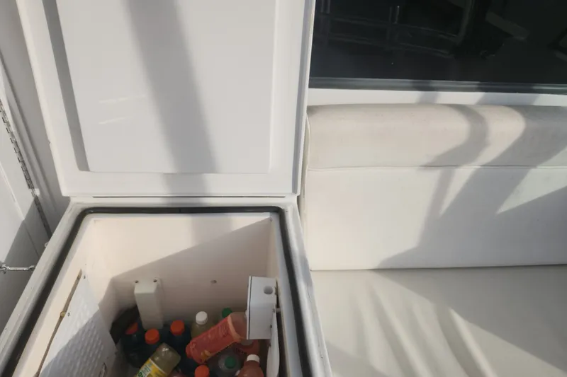 Slide: The Image of Open cooler with beverages on a 1999 Hatteras 65 Convertible yacht. - 54