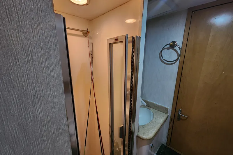 Slide: The Image of Bathroom interior of 1999 Hatteras 65 Convertible yacht with shower and sink. - 36