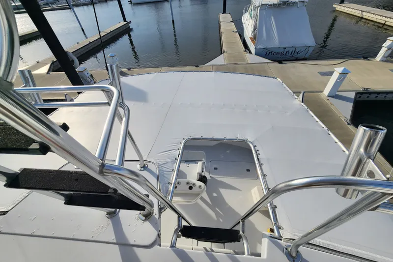 Slide: The Image of 1999 Hatteras 65 Convertible yacht at marina, view from upper deck. - 51
