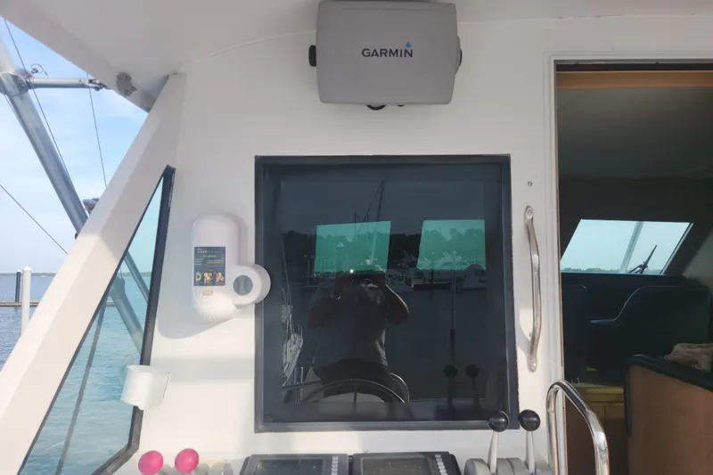 Slide: The Image of Interior view of a 1999 Hatteras 65 Convertible yacht with Garmin equipment. - 53