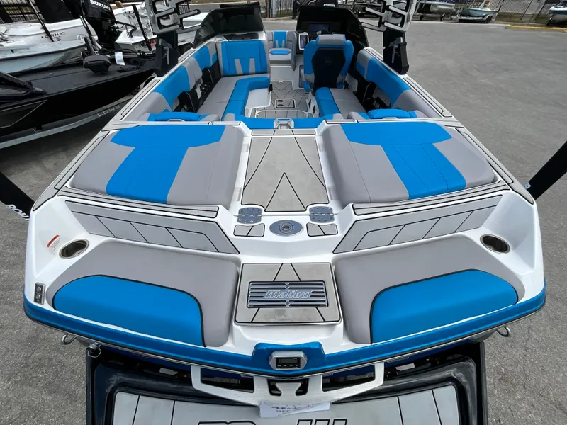 Slide: The Image of The image shows the spacious and stylish cockpit of a 2022 Malibu 23LVS boat. - 5