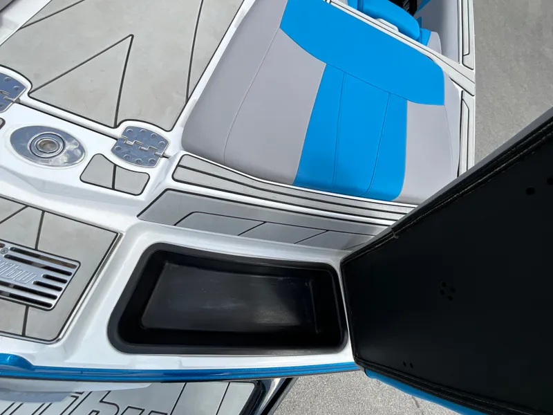 Slide: The Image of The image shows the cockpit of a 2022 Malibu 23LVS with blue and gray seating. - 9