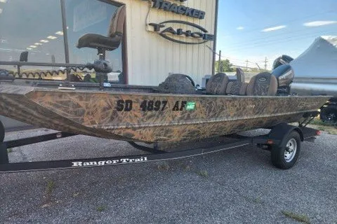 The Image of 2018 Ranger 1760 MPV camo boat on trailer, parked outside dealership. - 0