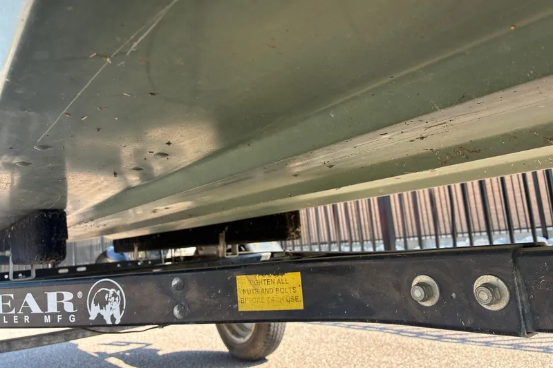 Slide: The Image of Underside view of a 1999 Jon Boat 1436 on a trailer. - 9