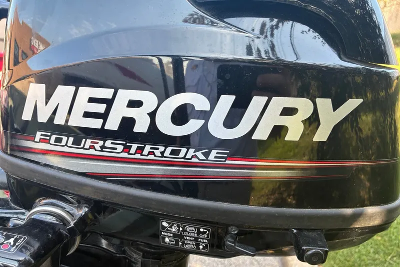 Slide: The Image of Mercury FourStroke outboard motor on a 1999 Jon Boat 1436. - 12