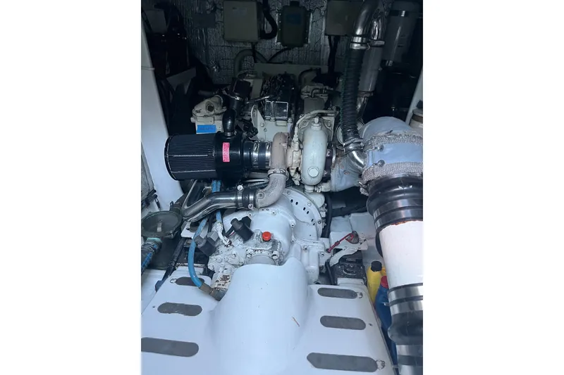 Slide: The Image of Engine room of 2003 Pachoud Yachts Power Cat, showcasing mechanical components and piping. - 29