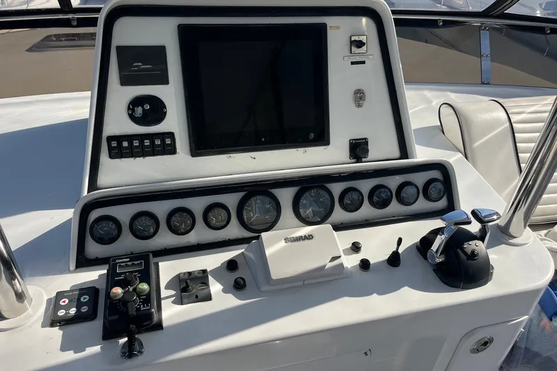 Slide: The Image of Control panel of a 2003 Pachoud Yachts Power Cat with navigation instruments. - 32