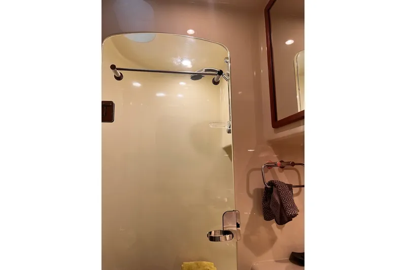 Slide: The Image of Bathroom interior of 2003 Pachoud Yachts Power Cat with glass shower door and towel rack. - 31