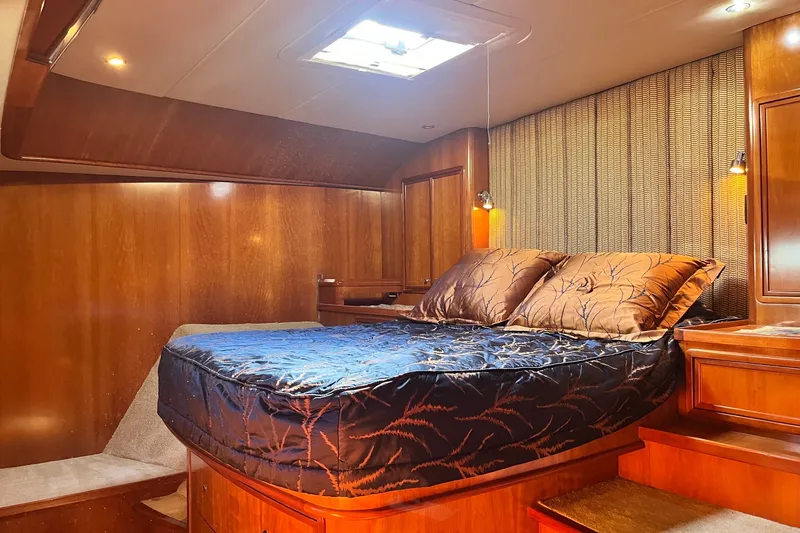 Slide: The Image of Luxurious cabin interior of 2003 Pachoud Yachts Power Cat with elegant wood finish. - 29