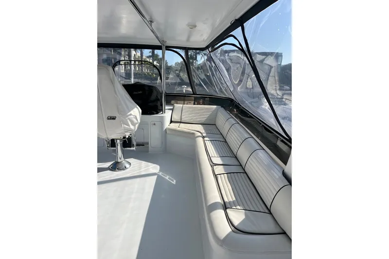 Slide: The Image of Interior of 2003 Pachoud Yachts Power Cat with white seating and clear windows. - 37