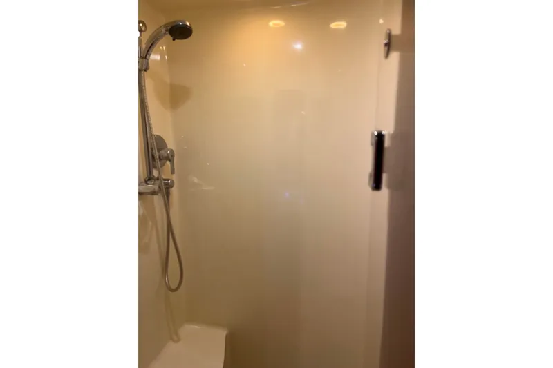 Slide: The Image of Shower area inside 2003 Pachoud Yachts Power Cat, featuring modern fixtures and sleek design. - 26