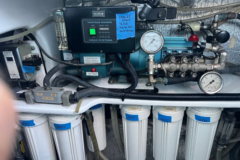 Slide: The Image of Engine room of a 2003 Pachoud Yachts Power Cat with filtration system and gauges. - 31