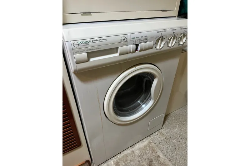 Slide: The Image of Front-loading Equator washing machine in a laundry room setting. - 33