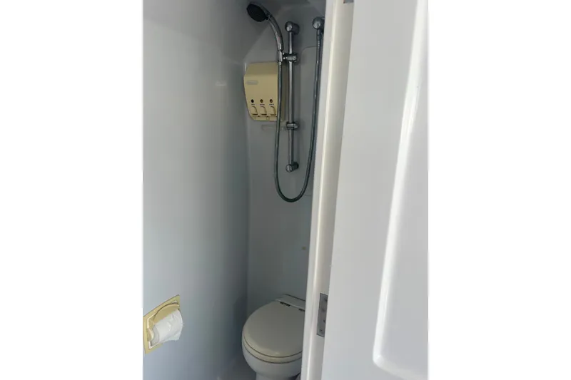 Slide: The Image of Compact bathroom in 2003 Pachoud Yachts Power Cat, featuring shower and toilet. - 27