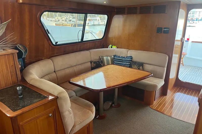 Slide: The Image of Luxurious interior of 2003 Pachoud Yachts Power Cat with plush seating and wooden finishes. - 15