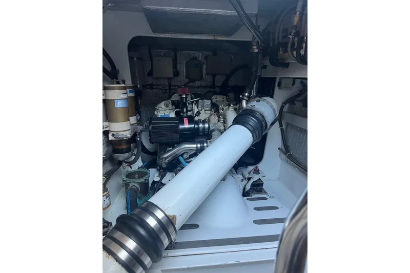 Slide: The Image of Engine room of 2003 Pachoud Yachts Power Cat, showcasing mechanical components and piping. - 30