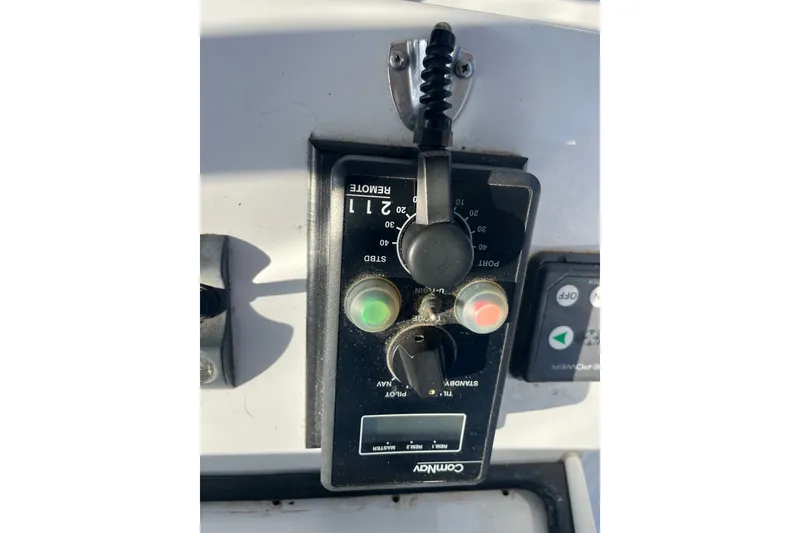 Slide: The Image of Control panel on a 2003 Pachoud Yachts Power Cat, featuring various switches and dials. - 34