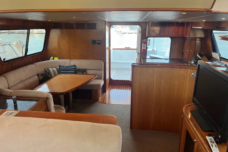 Slide: The Image of Luxurious 2003 Pachoud Yachts Power Cat interior with elegant wood finishes and comfortable seating. - 12