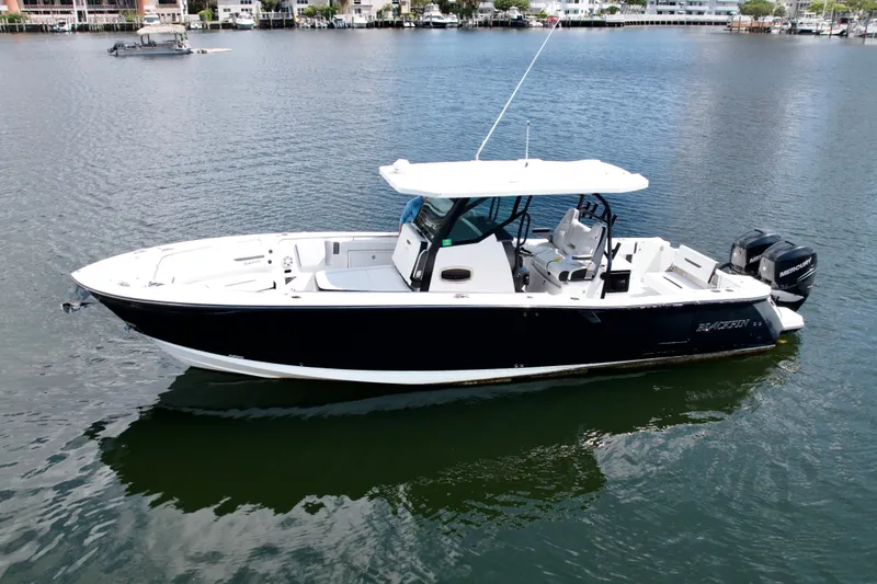The Image of 2021 Blackfin 332 CC boat on calm water, showcasing sleek design and modern features. - 0