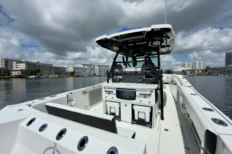Slide: The Image of 2021 Blackfin 332 CC boat on water, featuring sleek design and modern amenities. - 15