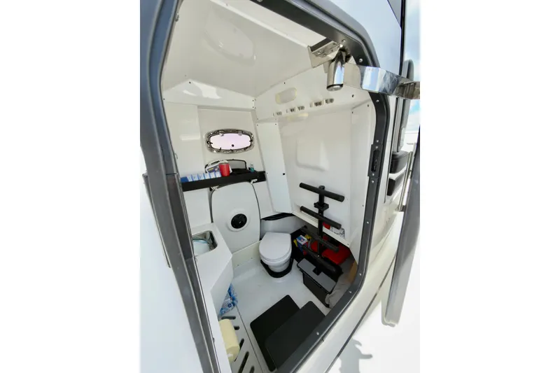 Slide: The Image of Interior of 2021 Blackfin 332 CC boat cabin with compact amenities. - 29
