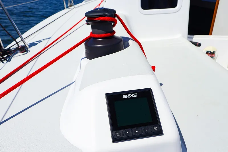 Slide: The Image of 2023 J Boats J/99 sailboat deck with B&G navigation display and red rope. - 28