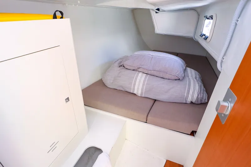 Slide: The Image of Cozy cabin interior of 2023 J Boats J/99 sailboat with bed and storage. - 55