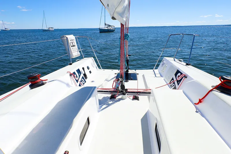 Slide: The Image of 2023 J Boats J/99 sailboat cockpit with ocean view, featuring modern rigging and equipment. - 24