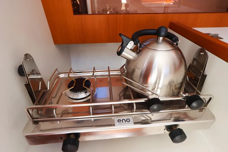 Slide: The Image of Stainless steel kettle on a marine stove in a 2023 J Boats J/99 yacht. - 44