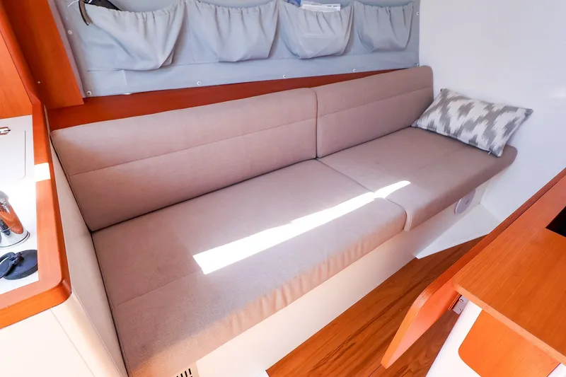 Slide: The Image of Interior of 2023 J Boats J/99 sailboat with beige sofa and cushion. - 46