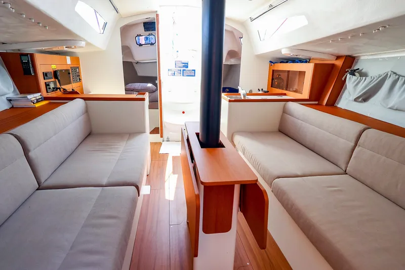 Slide: The Image of 2023 J Boats J/99 interior with modern seating, wood accents, and natural light. - 49