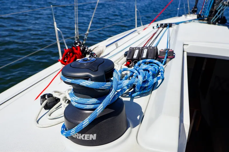 Slide: The Image of Close-up of 2023 J Boats J/99 sailboat deck with winch and ropes. - 15