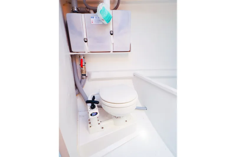 Slide: The Image of 2023 J Boats J/99 yacht bathroom with compact marine toilet and storage. - 61
