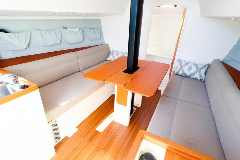 Slide: The Image of 2023 J Boats J/99 interior with cozy seating and wooden table. - 39