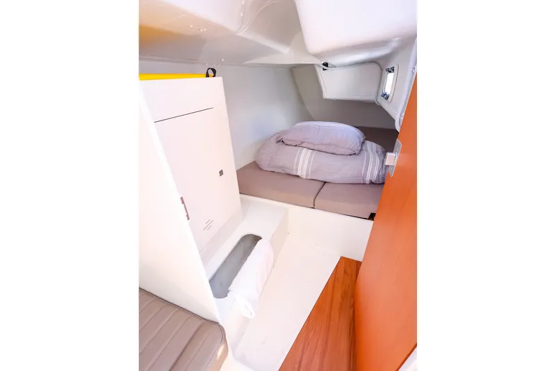 Slide: The Image of Cozy cabin interior of 2023 J Boats J/99 sailboat with bed and storage. - 56
