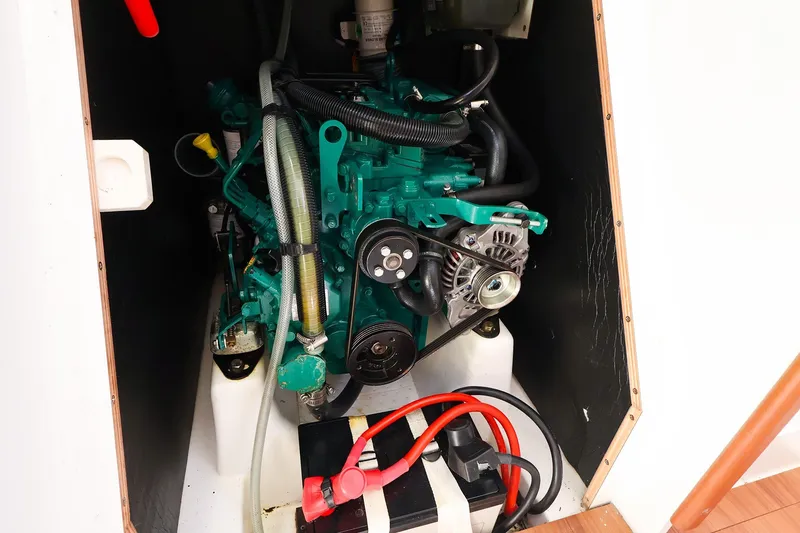 Slide: The Image of Engine compartment of 2023 J Boats J/99 sailboat, featuring a compact marine engine. - 62