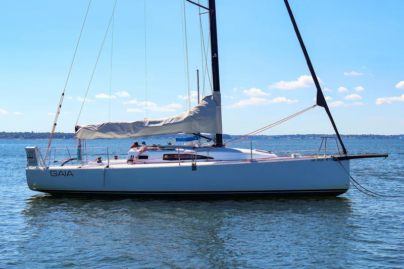 Slide: The Image of 2023 J Boats J/99 sailboat on calm water under clear blue sky. - 3