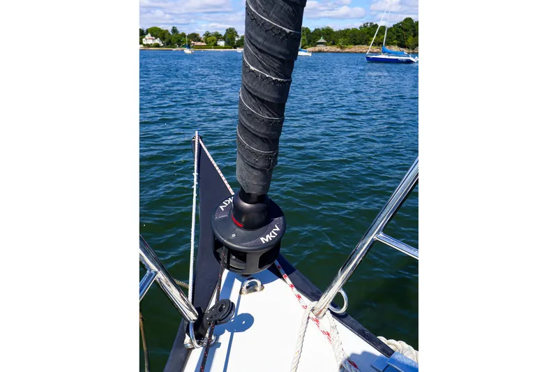 Slide: The Image of Bow of 2023 J Boats J/99 sailboat with furler, on calm water. - 19