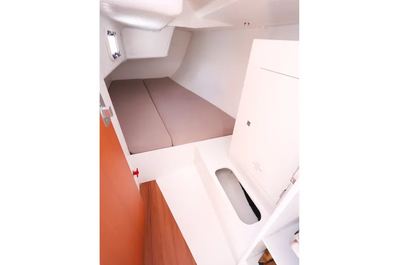 Slide: The Image of Interior cabin of 2023 J Boats J/99 sailboat, featuring a cozy sleeping area. - 58