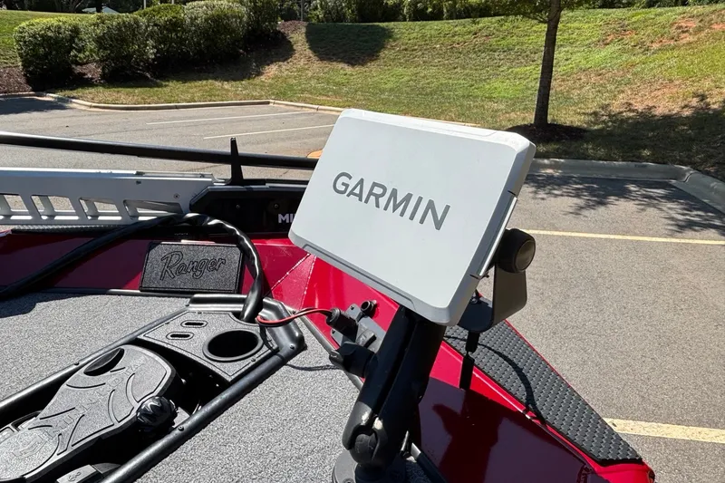 Slide: The Image of 2024 Ranger RT188 boat with Garmin navigation system in parking lot. - 13