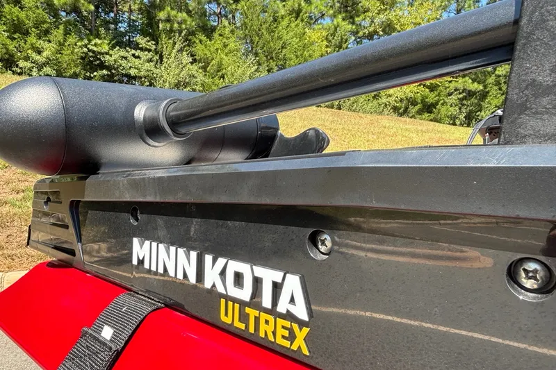 Slide: The Image of Minn Kota Ultrex motor on 2024 Ranger RT188 boat, outdoors with trees in background. - 15